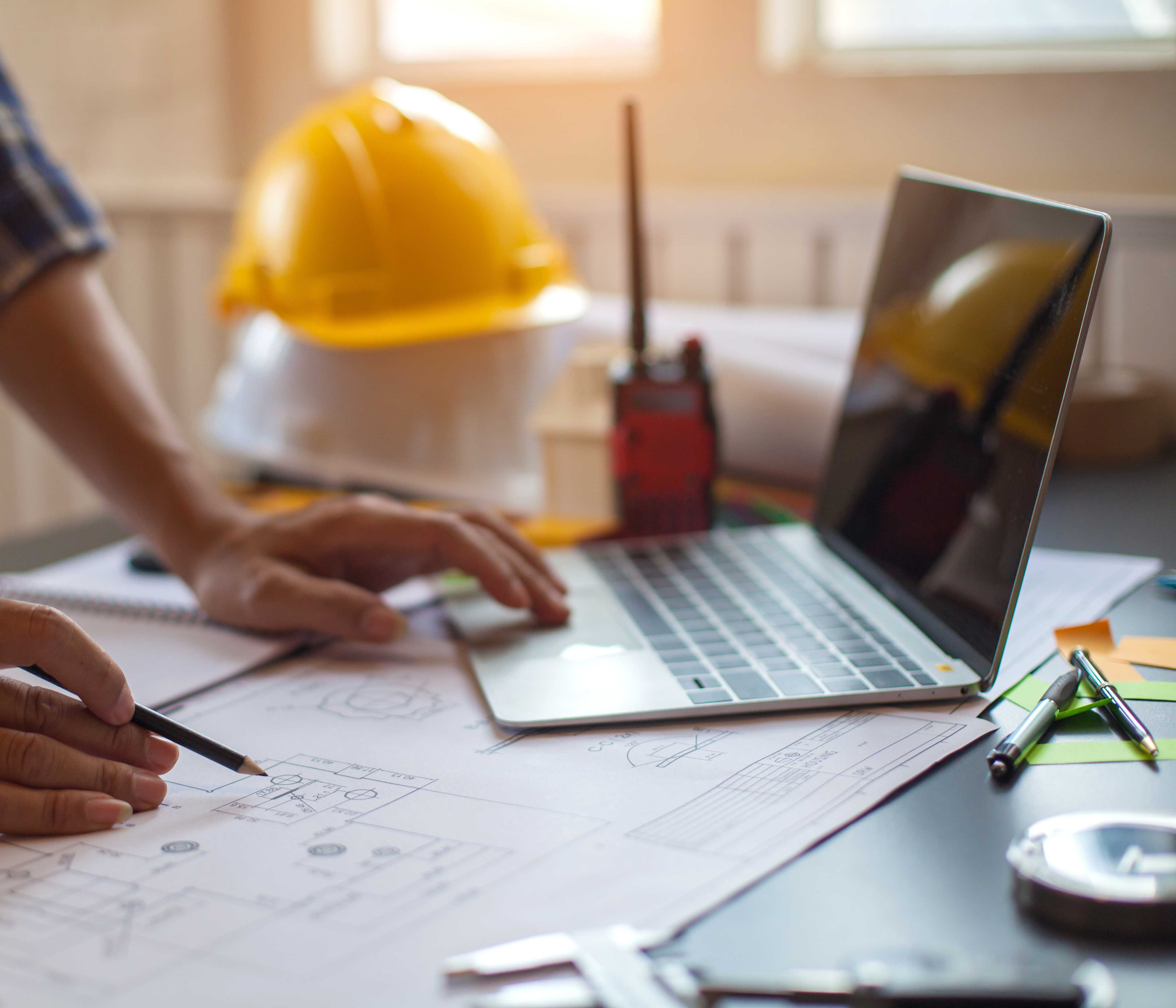 Facilities - A construction worker at a construction site.